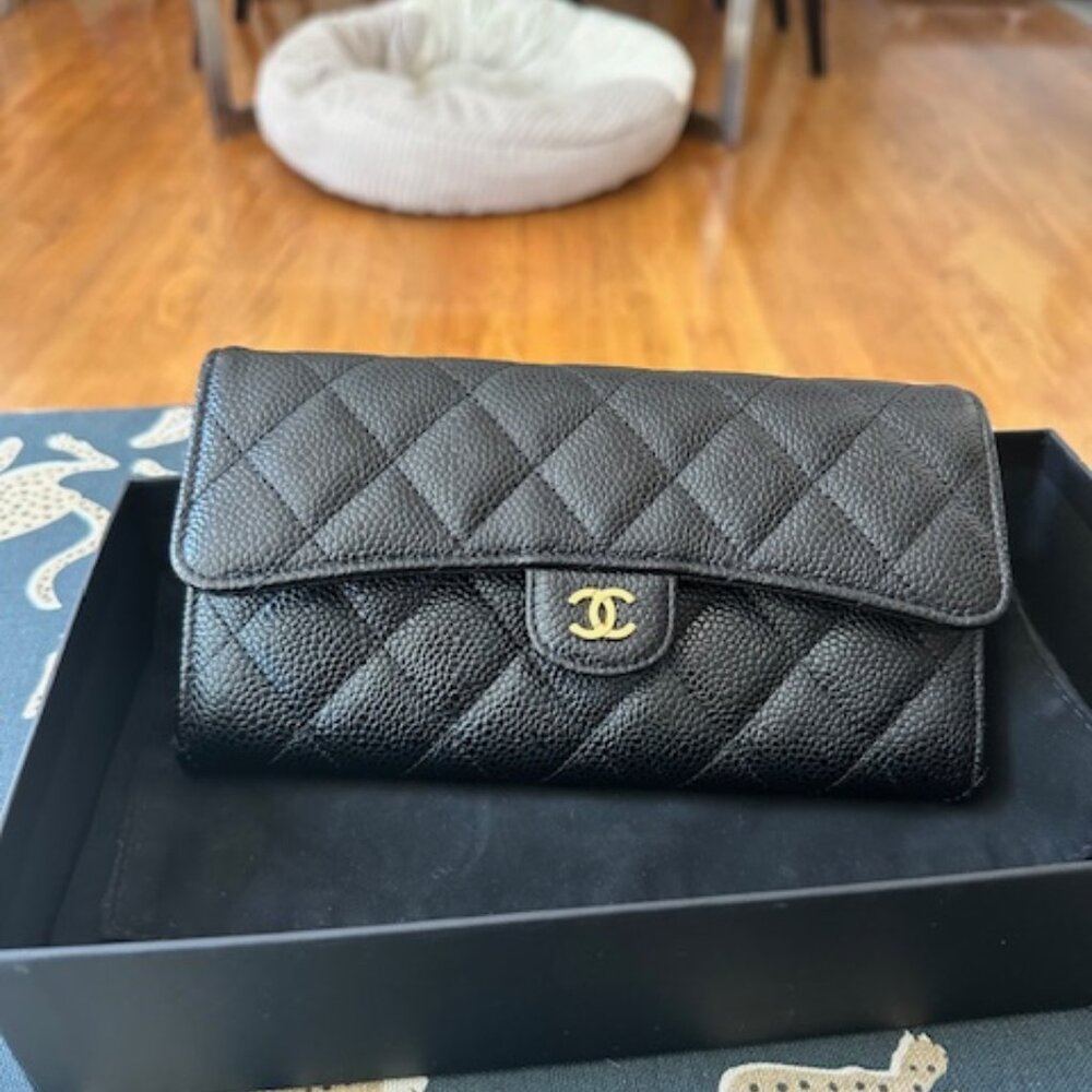 Chanel gusset flap wallet. Black caviar with burgundy interior, gold hardware